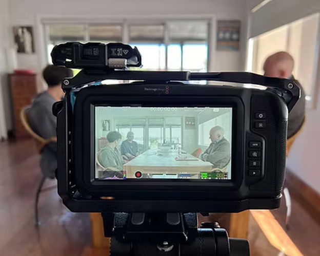 Production camera framing the indoor scene